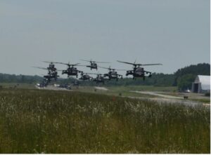 Army aviators in helicopters take flight.